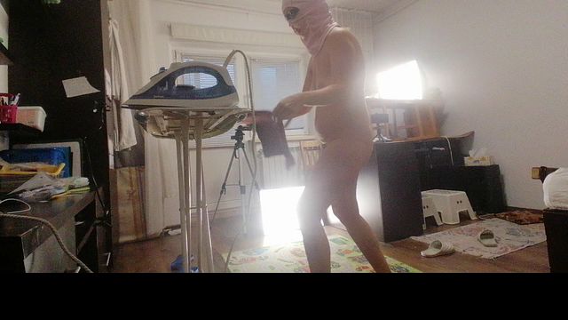 Naked Brunette Housewife Doing Chores