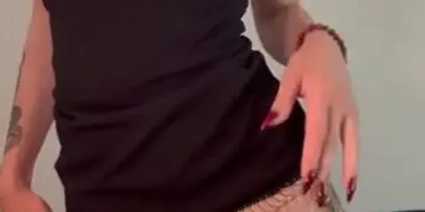 Sensual Minidress Showcases Tattooed Beauty