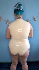Scottish Beauty Shines in Latex Bodysuit