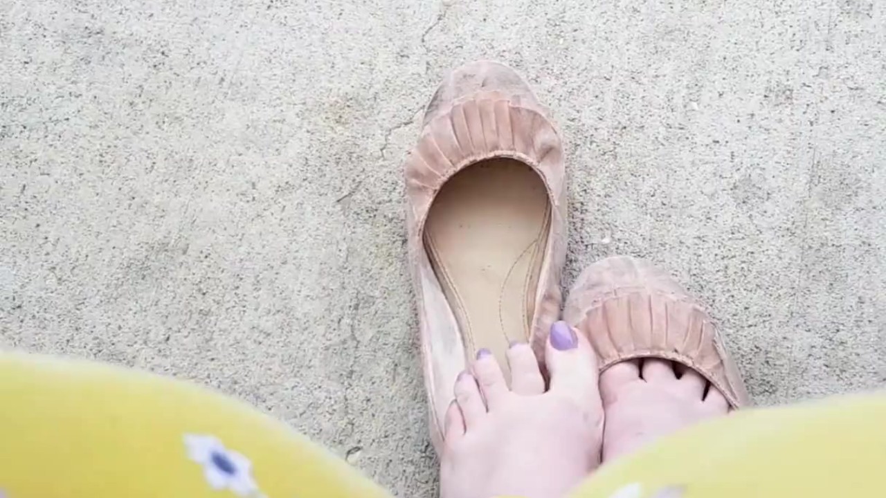 Barefoot Beauty Waits at the Bus Stop