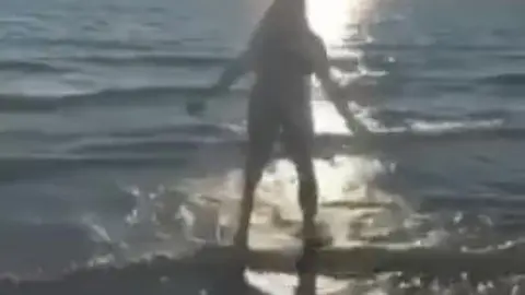 Public Beach Nude Cartwheel Stunt Caught on Camera