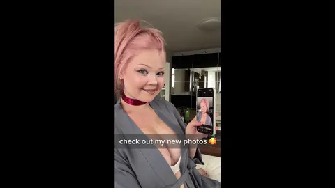 Blonde Bombshell Teases with Sultry Deep Cleavage Shots