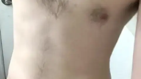 Shower Time: Slim Guy Prepares for a Refreshing Experience