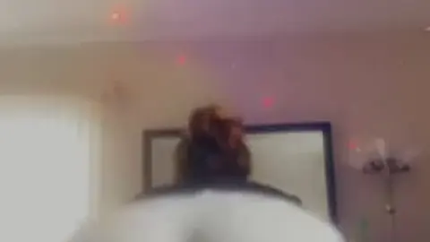 Sultry Milf Dances Seductively in Short Clip